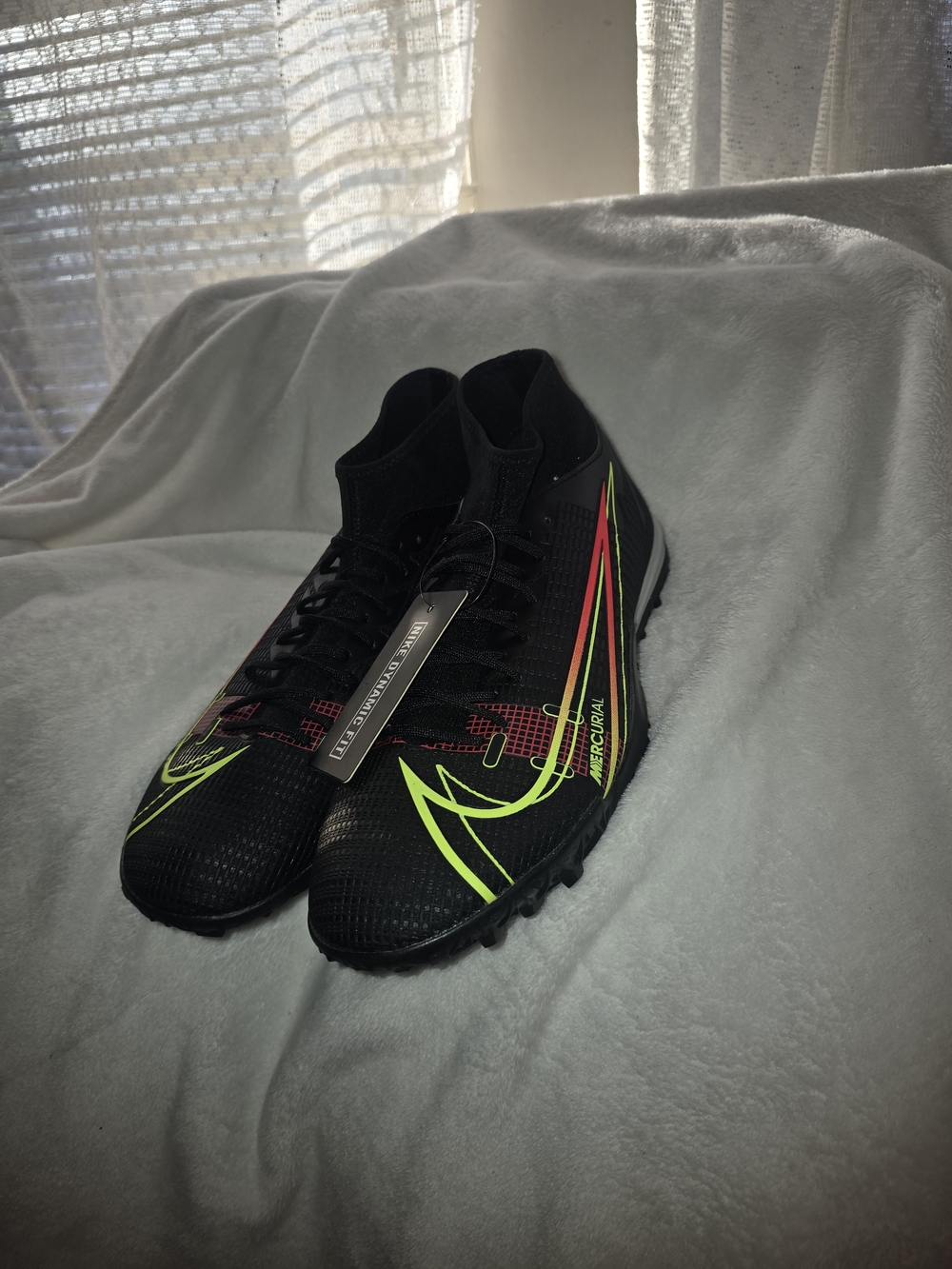 Nike Black Soccer Cleats with Neon Yellow and Red Accents